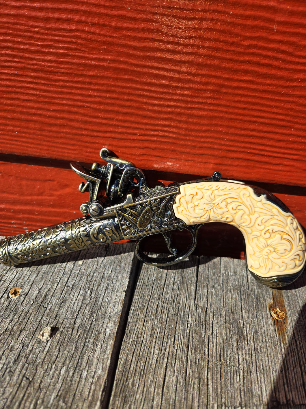 Flintlock Pocket Pistol with Scroll Design